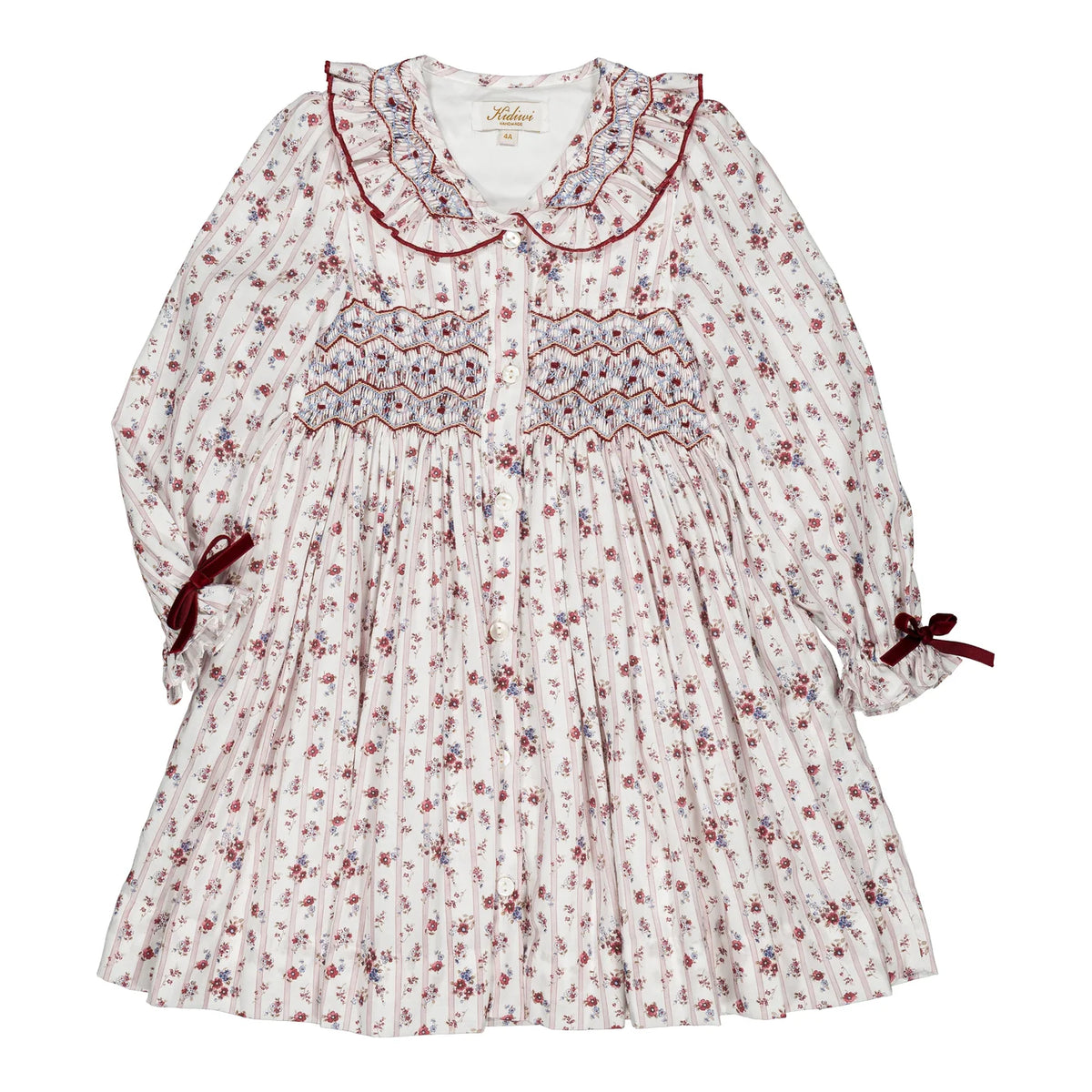 Adeline, girls’ smocked dress with a red floral pattern