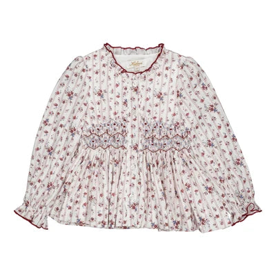 Dolores, smocked blouse for girls with a red floral pattern
