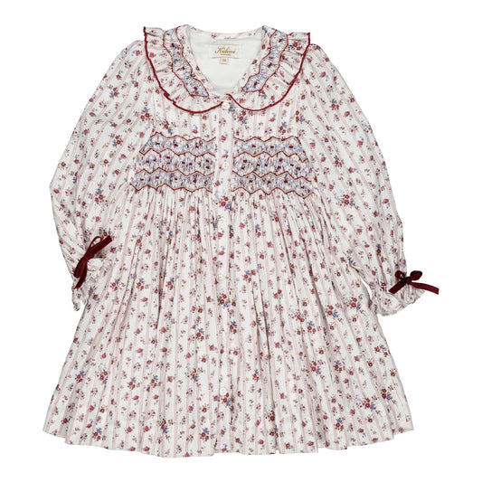 Adeline, girls’ smocked dress with a red floral pattern